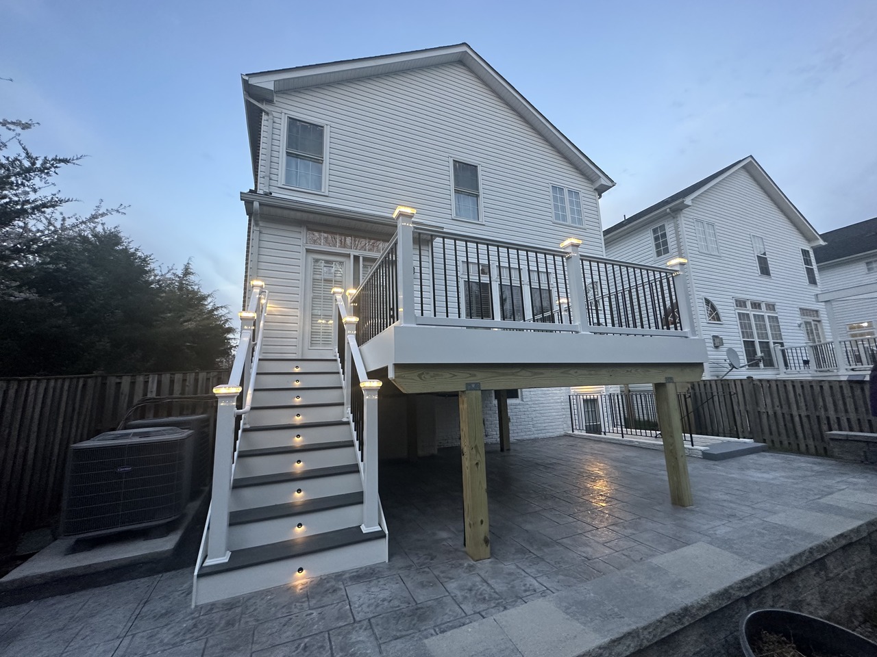 Trex Composite Deck with Adjoining Stamped Concrete Patio